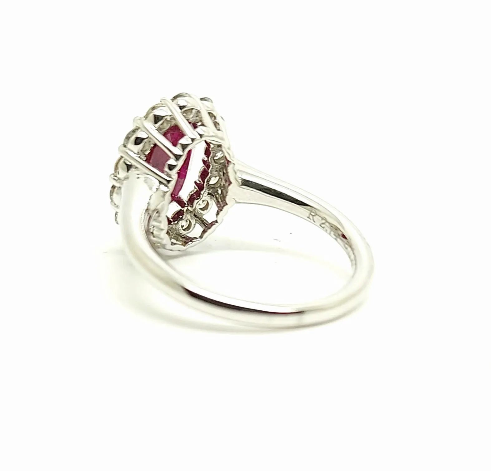 Oval Ruby and Round Diamond Halo Ring in 14k White gold